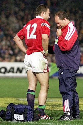 Mike Catt with Dr James Robson after suffering a calf injury against Australia A.