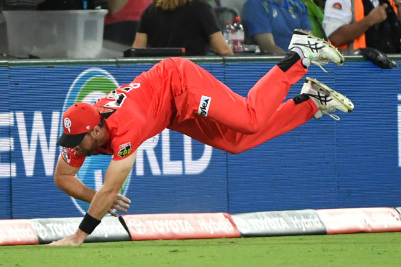 Daniel Christian saves a boundary with a determined effort.
