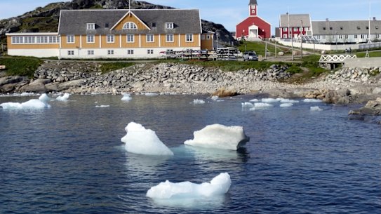 Small pieces of ice float off the shore in Nuuk, Greenland, last month, as the heatwave in Europe prompted fears, now realised, of a massive ice melting event.
