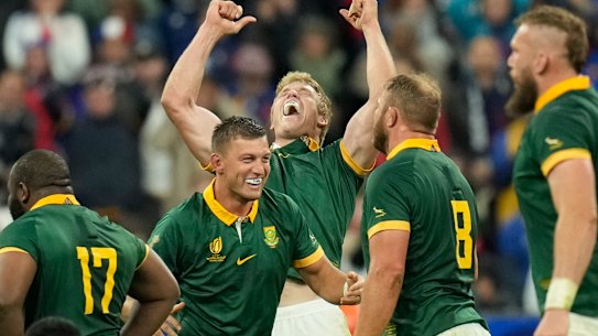 South African players celebrate after beating France.