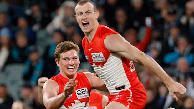 Angus Sheldrick and Chad Warner of the Swans celebrate a goal.