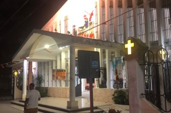 Adelynn ran towards the entrance of the church.