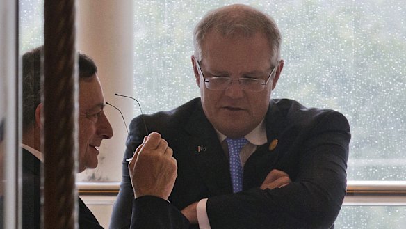 Then president of the European Central Bank, Mario Draghi, left, and Prime Minister Scott Morrison, then treasurer, chat during the G20 Finance Ministers meeting in Chengdu, China, in 2016.