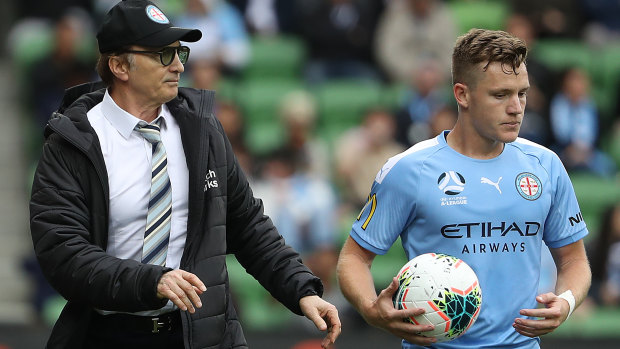 Melbourne City coach Erick Mombaerts speaks to Scott Galloway on the sidelines during the round two match between against Adelaide United at AAMI Park.
