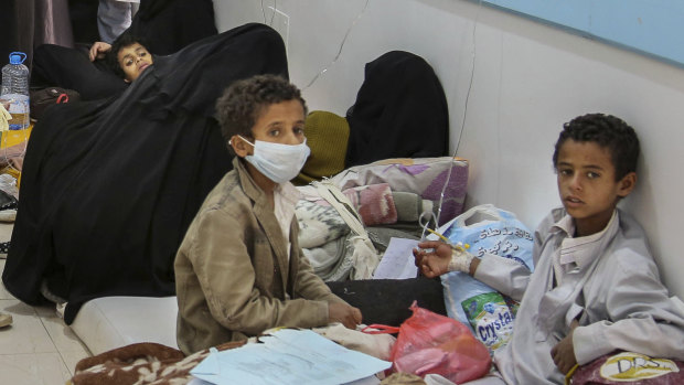 Patients suffering from severe diarrhoea and suspected of cholera, wait to receive treatment, at a hospital in Sanaa.