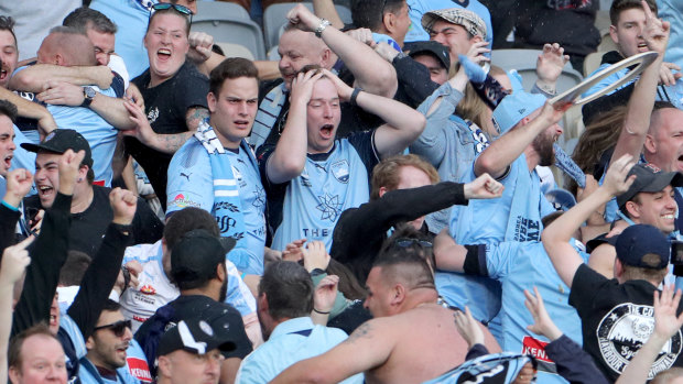 Sydney FC fans react during the grand final in Perth.