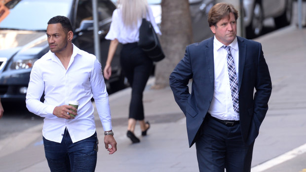Manly coach Des Hasler arrives at court with Api Koroisau on Tuesday.
