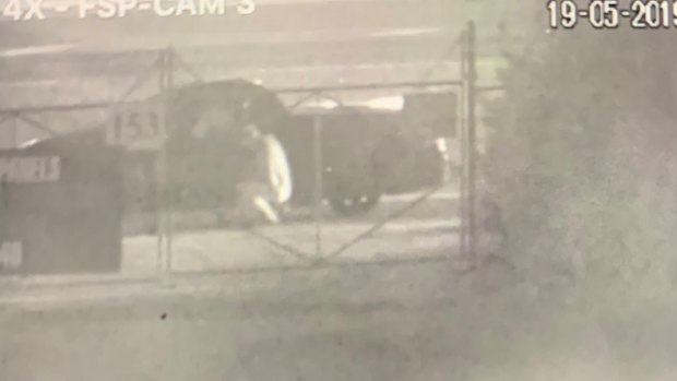 CCTV captures the moment when three men break into a South Geelong tow yard and steal back a luxury BMW with the help a of an angle grinder.