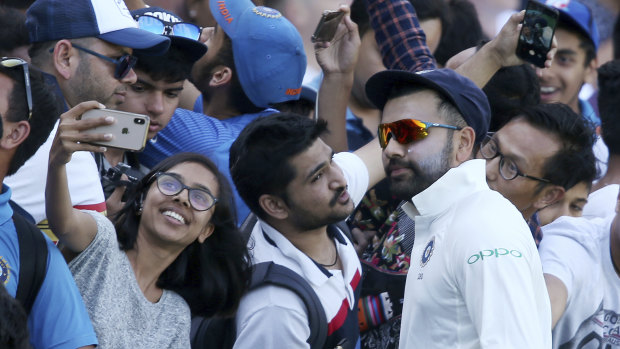 Rohit Sharma meets fans during a break in India's tour match in Sydney last month.