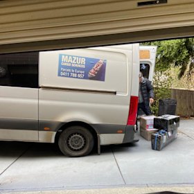 Juzenas is snapped unloading a truck.