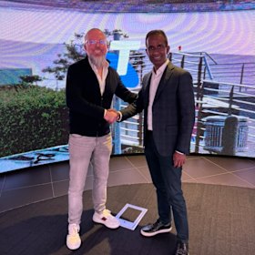 Telstra’s Kim Krogh Andersen (left) and Accenture’s Karthik Narain work together as part of the joint venture.