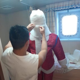 One crew member of the Anastasia consoling himself with a  Santa he made from material found onboard. 