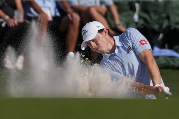 Ludvig Aberg hits from the bunker on the 18th.