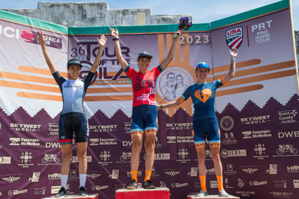 Shayna Powless (left), Austin Killips (centre), and Nadia Gontova (right) on the podium after a stage victory in New Mexico.