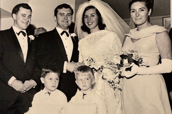 David Haselhurst and his wife Ann on their wedding day. Pictured with them, best man Howard Haselhurst, left, and bridesmaid Judy Campsie (right). Wedding pages, in front: Glen Ilich and Philip Skrabanich.