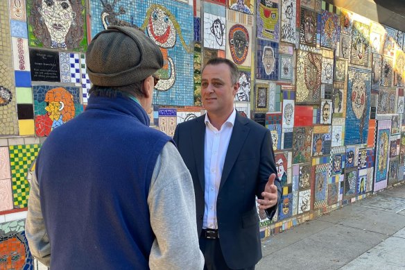 Tim Wilson pressing the flesh with commuters on Wednesday.