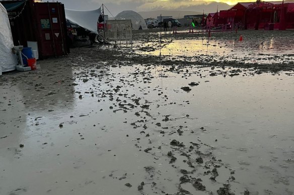 Freak rains have turned Burning Man’s usually dusty landscape into ankle deep mud.