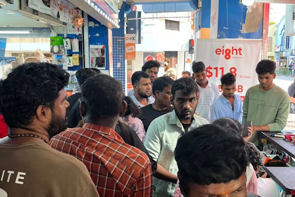 A single-file shuffle is needed to navigate Serangoon Road in the heart of Little India on a Sunday. 