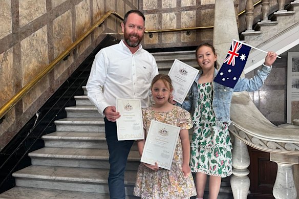 Former Invercargill resident Joel McPhee with two of his daughters when he became an Australian citizen in 2024 at Brisbane City Hall.