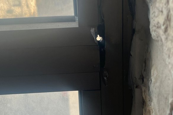 The bullet hole in the window frame of Abu-Izneid’s student accommodation near Jerusalem.