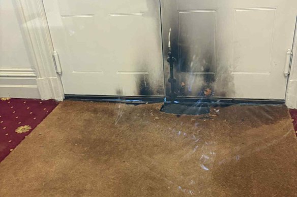 The singed doors seen from inside the East Melbourne Synagogue after the arson attack on Friday night.