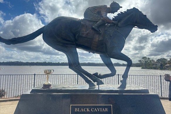 The Melbourne Cup trophy is rested beside Nagambie’s Black Caviar statue.