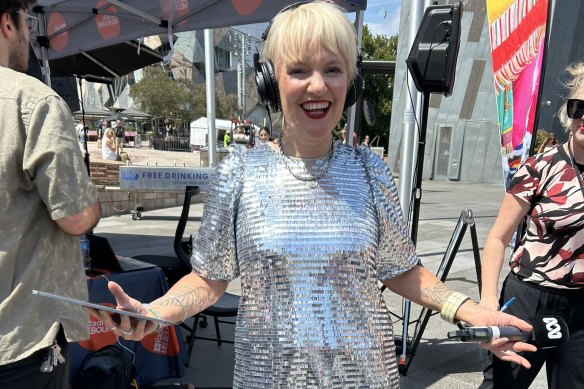 Jacinta Parsons shows off her tattoos at an outside broadcast from Federation Square.