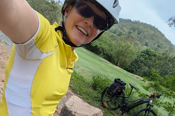 Clotilde Belanger with her legal e-bike behind the Ashgrove Golf Club, which is part of the Enoggera Creek Bikeway.