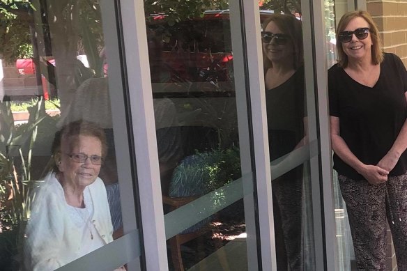 Mary Watson, right, visited her mother, Alice Bacon, at Newmarch House through the window for her birthday on April 5.