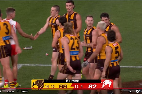 A soft drink bottle on the field as Hawthorn celebrates Thursday night’s win over Sydney.