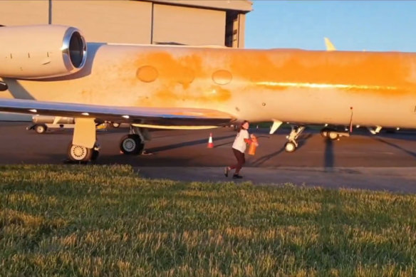 Screengrabs from a video posted by activist group Just Stop Oil of private jets being spray-painted at a London airport. 