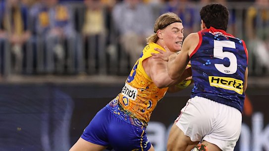 Harley Reid fends off Christian Petracca on Sunday.