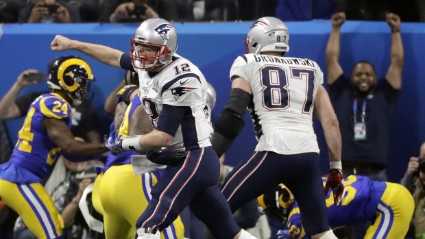 Untouchable: Tom Brady (No.12) celebrates a touch down during Super Bowl LIII.