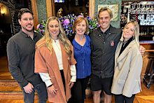 Joy Moore (centre) pictured with her children Tom and Sam and their partners.