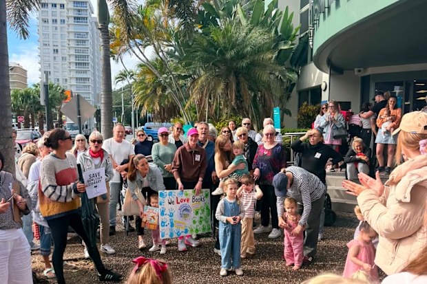Community members turn out to protest the library closure.