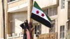 Turkish-backed Syrian rebels enter the town of Saraqeb in Idlib province, Syria, Thursday, Feb. 27, 2020. 