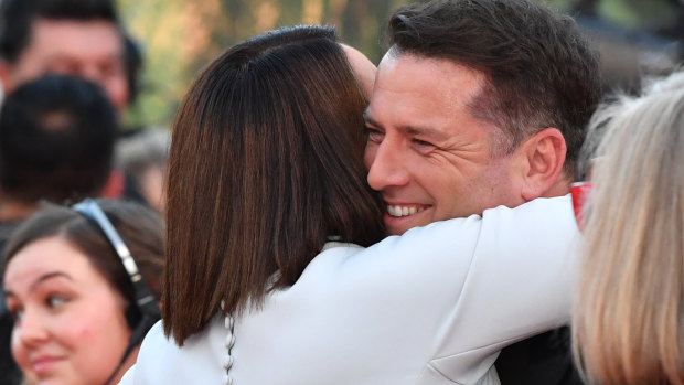 Old mate: Julia Morris hugs Karl Stefanovic on this year's Logie's red carpet.