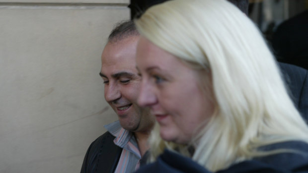 Nicola Gobbo with Tony Mokbel outside court in 2004.