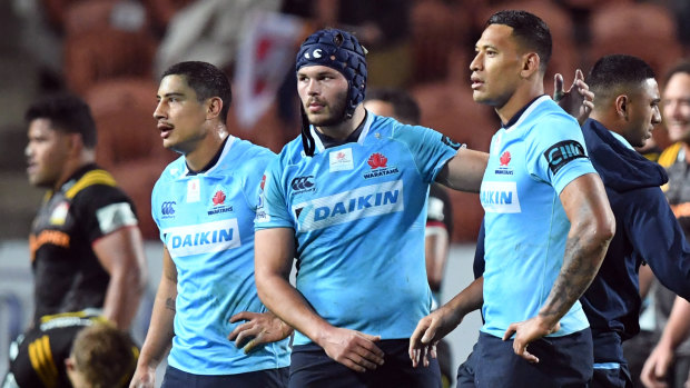 Waratahs players appear dejected after their loss to the Chiefs.