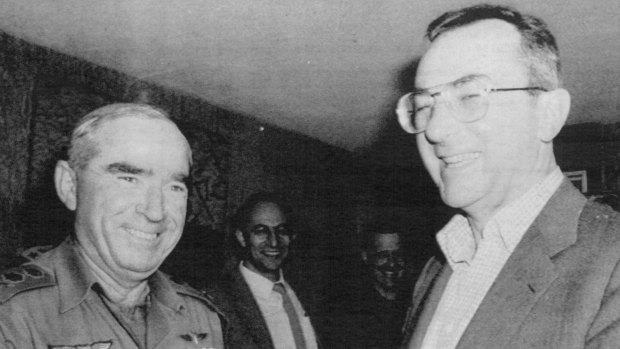 Rafi Eitan, then Israel's chief of staff, greets its defence minister Moshe Arens, in 1982.