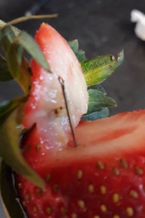 A photo of a contaminated strawberry posted to social media. 