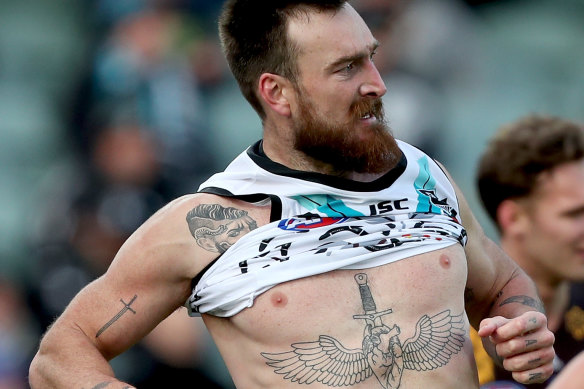 Port's Charlie Dixon lost his guernsey in a melee. 