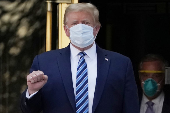 President Donald Trump walks out of the Walter Reed hospital to return to the White House after receiving treatments for COVID-19 earlier this week.