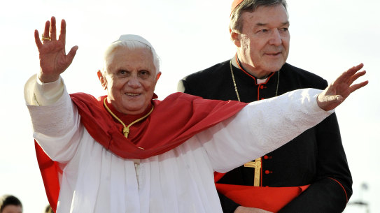 Pope Benedict XVI,  left, waves as walks to the stage with Cardinal George Pell while arriving at Bangaroo for his official World Youth Day welcome in Sydney in 2008.