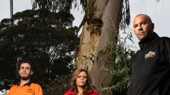 Metropolitan Aboriginal Land Council CEO, Nathan Moran, (front) chair Yvonne Weldon, and Josh Marr, Land Conservation Officer, in Reconciliation Park, Redfern.