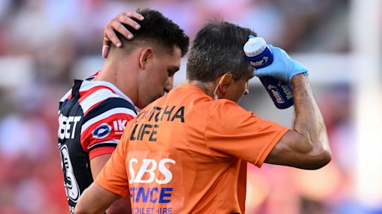 Roosters Victor Radley leaves Suncorp Stadium after suffering a heavy concussion.