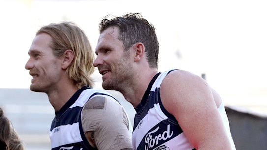 Tom Stewart and Patrick Dangerfield greet fans.
