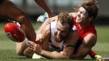Connor Blakely is tackled by Ed Langdon.