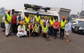 Some members of Sikh Volunteers Australia, on the road. Jaswinder Singh is pictured kneeling, front  right.