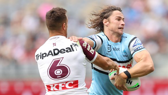 Nicho Hynes tries to evade a Luke Brooks tackle on Saturday.